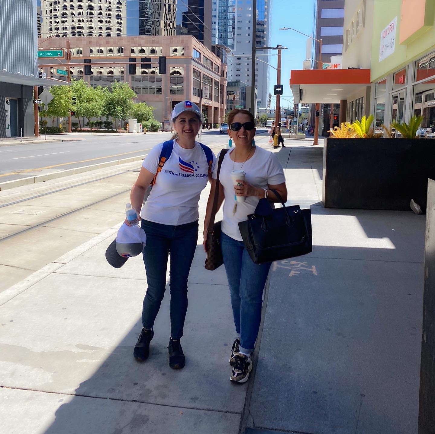 Two women in Faith and Freedom Coalition shirts canvassing